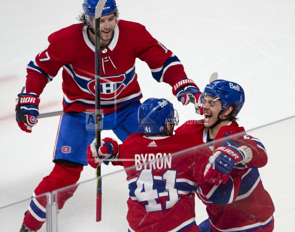 Ryan Remiorz Montreal Canadiens' Jesperi Kotkaniemi, right, celebrates with Paul Byron (41) and Josh Anderson (17) after scoring against the Toronto Maple Leafs in overtime in Game 6 of an NHL hockey Stanley Cup first-round playoff seres Saturday, May 29, 2021, in Montreal. (Ryan Remiorz/The Canadian Press via AP)