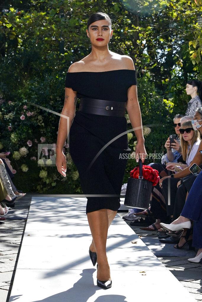 Richard Drew The Michael Kors Spring/Summer 2022 collection is modeled during Fashion Week, in New York, Friday, Sept. 10, 2021. (AP Photo/Richard Drew)