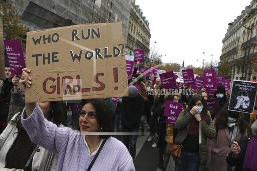 FILE - Women demonstrate against violence against women, Nov. 20, 2021 in Paris. French Junior Interior Minister Marlene Schiappa said France must further help women victims of violence to report abuses to the police, including via a new process to file a complaint at a friend’s home or in a place where they feel safe. (AP Photo/Adrienne Surprenant, File)