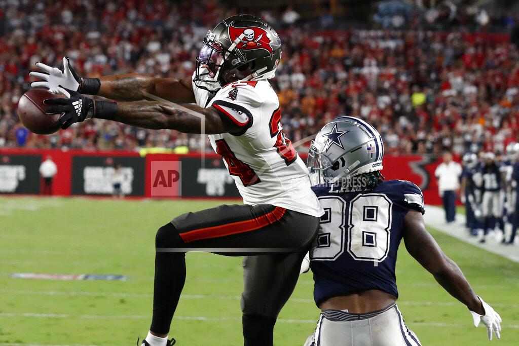 Scott Audette Tampa Bay Buccaneers cornerback Carlton Davis III (24) breaks up a pass intended for Dallas Cowboys wide receiver CeeDee Lamb (88) during the second half of an NFL football game Thursday, Sept. 9, 2021, in Tampa, Fla. (AP Photo/Scott Audette)