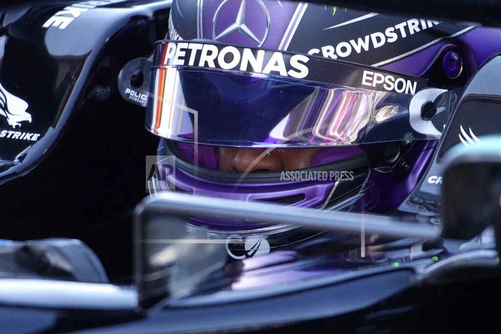 Emilio Morenatti Mercedes driver Lewis Hamilton of Britain sits in his car after he clocked the fastest time in the qualifying for the Spanish Formula One Grand Prix at the Barcelona Catalunya racetrack in Montmelo, just outside Barcelona, Spain, Saturday, May 8, 2021. The Spanish Grand Prix will be held on Sunday. (AP Photo/Emilio Morenatti, Pool)