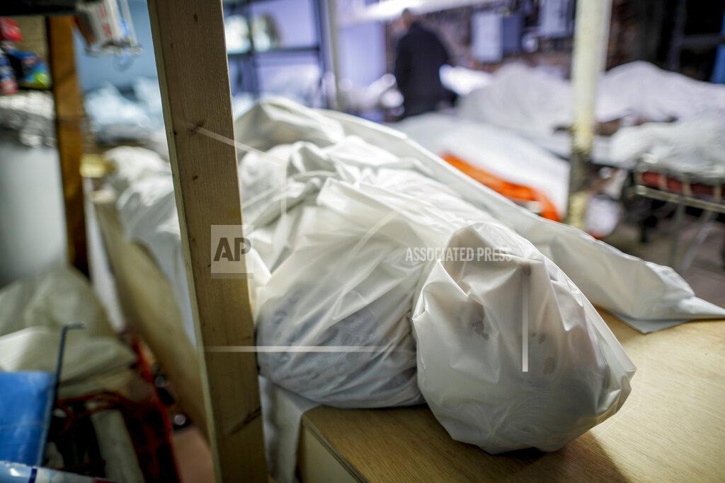 John Minchillo Bodies are wrapped in protective plastic in a holding facility at Daniel J. Schaefer Funeral Home, Thursday, April 2, 2020, in the Brooklyn borough of New York. The company is equipped to handle 40-60 cases at a time. But amid the coronavirus pandemic, it was taking care of 185 Thursday morning. (AP Photo/John Minchillo)