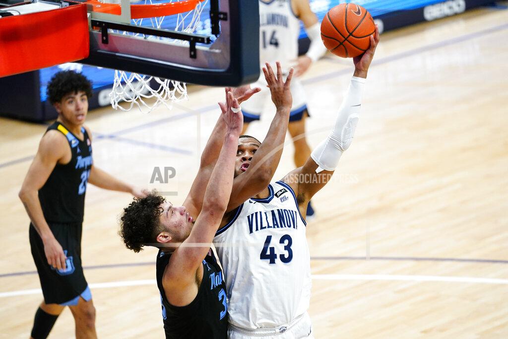 Matt Slocum Villanova's Eric Dixon (43) goes up for a shot against Marquette's Dawson Garcia (33) during the second half of an NCAA college basketball game, Wednesday, Feb. 10, 2021, in Villanova, Pa. (AP Photo/Matt Slocum)