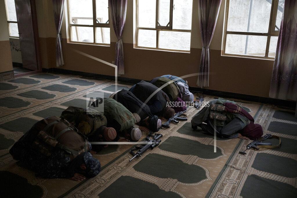 Felipe Dana Taliban members lay their weapons down as they pray inside a mosque in Kabul, Afghanistan, Sunday, Sept. 12, 2021. (AP Photo/Felipe Dana)