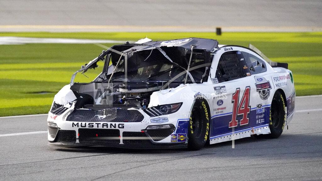 John Raoux Chase Briscoe (14) drives down pit road to repair damage to his car after he was in a crash during the NASCAR Cup Series road course auto race at Daytona International Speedway, Sunday, Feb. 21, 2021, in Daytona Beach, Fla. (AP Photo/John Raoux)