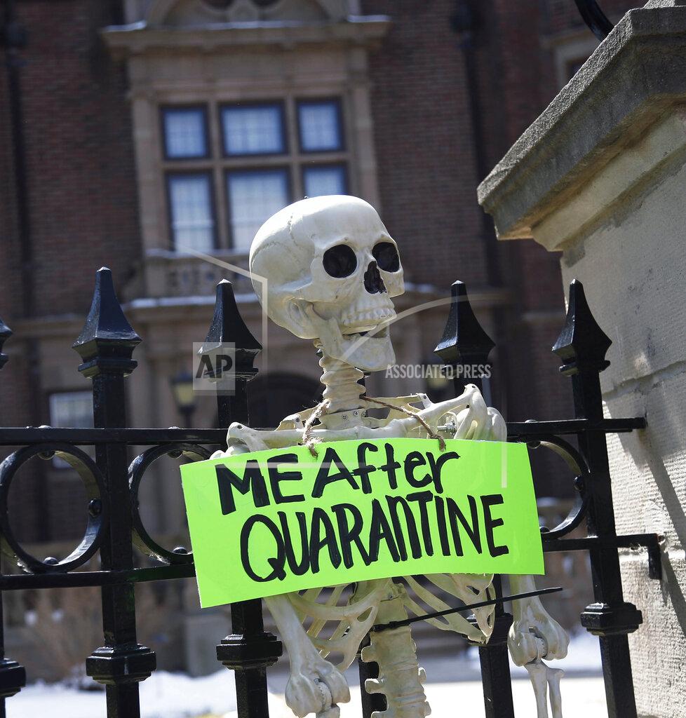 Jim Mone A mock skeleton is attached to the fence as protesters gathered outside Minnesota Gov. Tim Walz' official residence Friday, April 17, 2020, in St. Paul, Minn., to call on him to loosen stay-at-home restrictions imposed across the state because of the coronavirus. The new coronavirus causes mild or moderate symptoms for most people, but for some, especially older adults and people with existing health problems, it can cause more severe illness or death. (AP Photo/Jim Mone)