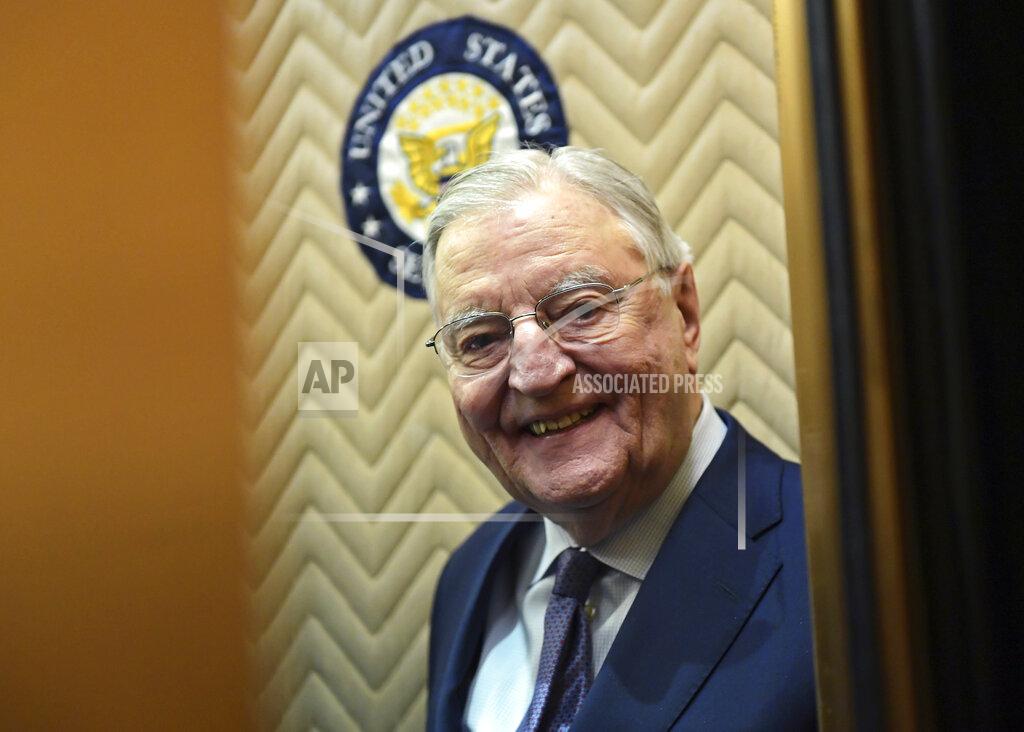 Susan Walsh FILE - In this Wednesday, Jan. 3, 2018, file photo, former Vice President Walter Mondale smiles as he gets on an elevator on Capitol Hill in Washington. Mondale, a liberal icon who lost the most lopsided presidential election after bluntly telling voters to expect a tax increase if he won, died Monday, April 19, 2021. He was 93. (AP Photo/Susan Walsh, File)