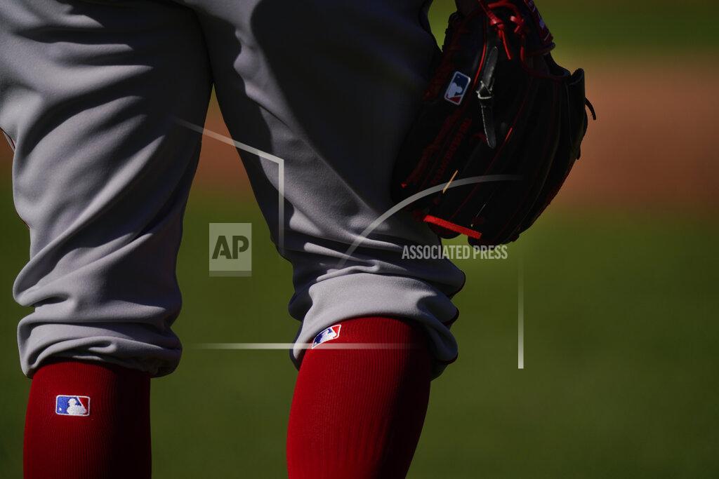 Brynn Anderson Boston Red Sox pitcher Darwinzon Hernandez (63) holds a glove and waits to workout during spring training baseball practice on Monday, Feb. 22, 2021, in Fort Myers, Fla. (AP Photo/Brynn Anderson)
