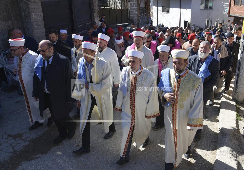 Jordan Simeonov Imams lead the procession during circumcision ceremony in the village of Ribnovo, Bulgaria, Sunday, April 11, 2021. Despite the dangers associated with COVID-19 and government calls to avoid large gatherings, Hundreds of people flocked to the tiny village of Ribnovo in southwestern Bulgaria for a four-day festival of feasting, music and the ritual of circumcision which is considered by Muslims a religious duty and essential part of a man's identity. (AP Photo/Jordan Simeonov)