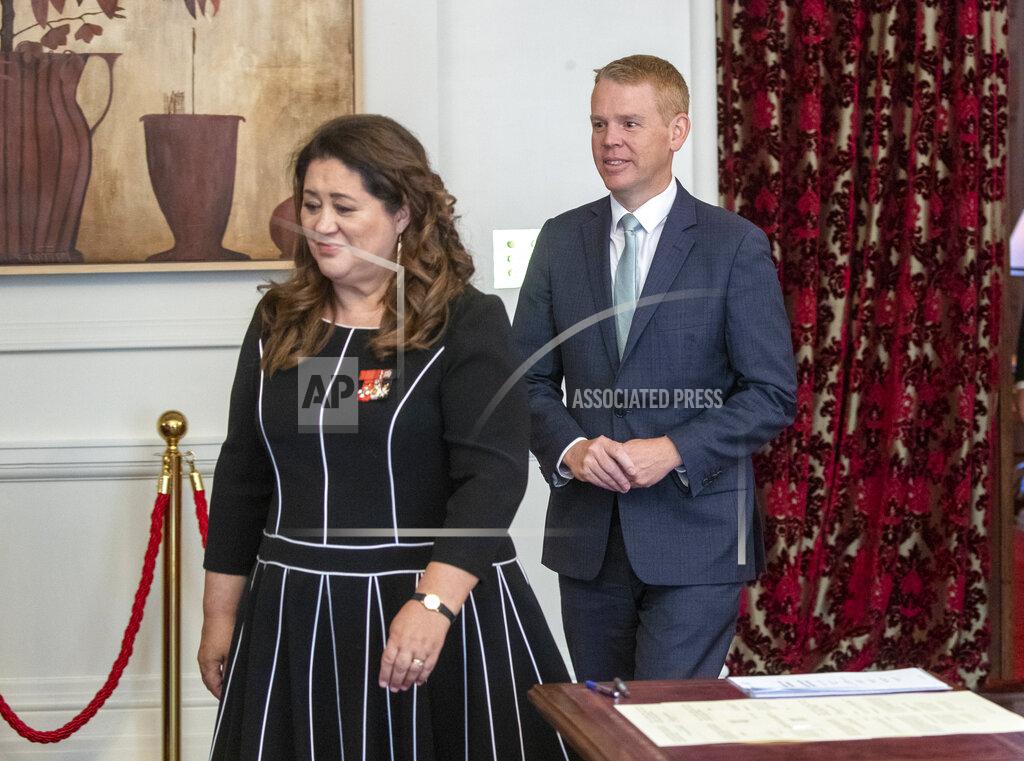 Mark Mitchell Chris Hipkins, right, follows Governor-General Dame Cindy Kiro before he is s sworn in as New Zealand's next prime minister at Government House in Wellington, Wednesday, Jan. 25, 2023. Hipkins, 44, has promised a back-to-basics approach focusing on the economy and what he described as the "pandemic of inflation." (Mark Mitchell/New Zealand Herald via AP)