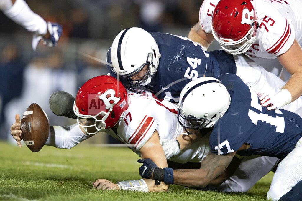 Barry Reeger FILE - In this Nov. 30, 2019, file photo, Penn State defenders Robert Windsor (54) and Jayson Oweh (28) cause Rutgers quarterback Johnny Langan (17) to fumble in the third quarter of an NCAA college football game in State College, Pa. Big Ten is going to give fall football a shot after all. Less than five weeks after pushing football and other fall sports to spring in the name of player safety during the pandemic, the conference changed course Wednesday, Sept. 16, 2020, and said it plans to begin its season the weekend of Oct. 23-24. (AP Photo/Barry Reeger, File)