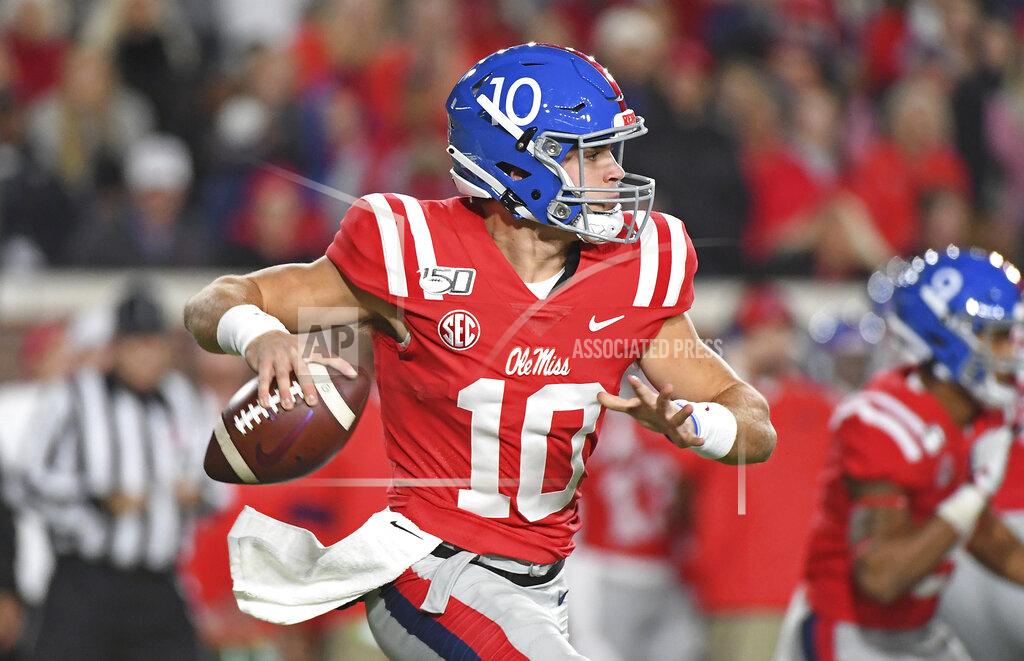 Thomas Graning Mississippi quarterback John Rhys Plumlee (10) looks for a receiver during the first half of the team's NCAA college football game against LSU in Oxford, Miss., Saturday, Nov. 16, 2019. (AP Photo/Thomas Graning)