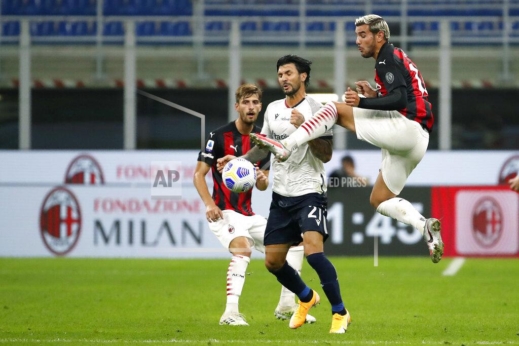 Antonio Calanni AC Milan's Theo Hernandez, right, fights for the ball with Bologna's Roberto Soriano during the Serie A soccer match between AC Milan and Bologna at the San Siro stadium, in Milan, Italy, Monday, Sept. 21, 2020. (AP Photo/Antonio Calanni)