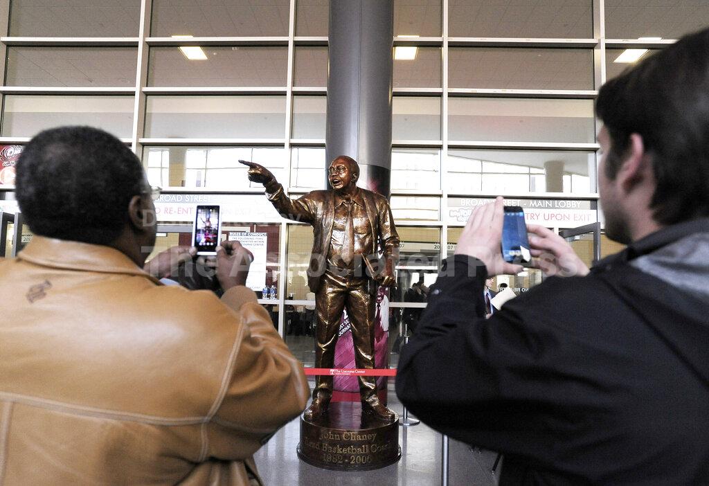 FILE - A statue of former Temple coach John Chaney is unveiled before the start of an NCAA college basketball game against Villanova in Philadelphia, in this Saturday, Feb. 1, 2014, file photo. John Chaney, one of the nation’s leading Black coaches and a commanding figure during a Hall of Fame basketball career at Temple, has died. He was 89. His death was announced by the university Friday, Jan. 29, 2021.(AP Photo/Michael Perez, File)