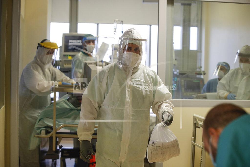 Luca Bruno Doctors tend to a coronavirus patient in the Intensive Care Unit at Varese’s Circolo Hospital, in Varese, Italy, Friday, Nov.6, 2020. During Italy's autumn pandemic resurgence, concern is falling less on intensive care wards and more on regular medical wards, as eight regions have seen the needle move alarmingly into the red-alert zone with more than half of hospital beds dedicated to coronavirus patients. (AP Photo/Luca Bruno)