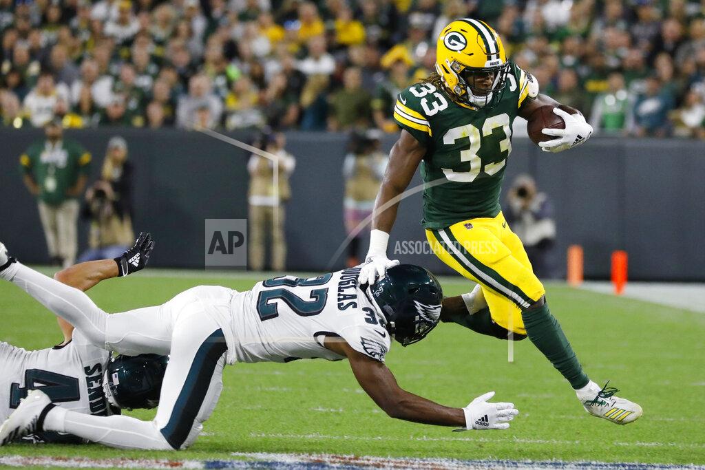 Jeffrey Phelps Green Bay Packers running back Aaron Jones breaks the tackle of Philadelphia Eagles cornerback Rasul Douglas during the first half of an NFL football game Thursday, Sept. 26, 2019, in Green Bay, Wis. (AP Photo/Jeffrey Phelps)