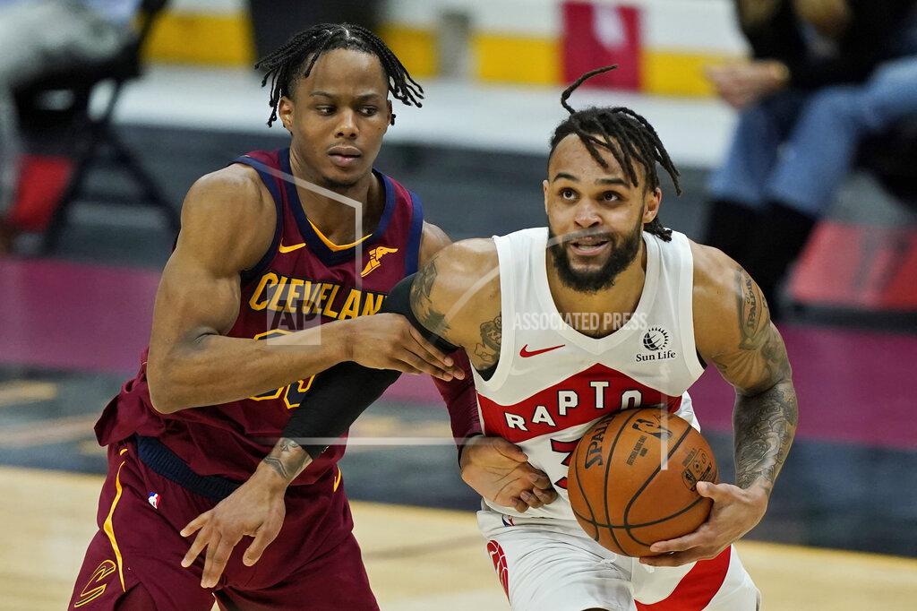 Tony Dejak Toronto Raptors' Gary Trent Jr., right, drives to the basket against Cleveland Cavaliers' Isaac Okoro in the second half of an NBA basketball game, Saturday, April 10, 2021, in Cleveland. (AP Photo/Tony Dejak)
