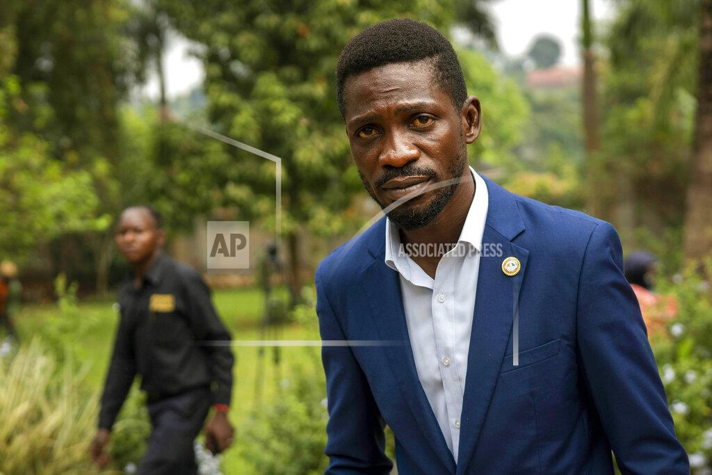 Jerome Delay FILE- in this Jan. 15, 2021 file photo, Uganda's leading opposition challenger Bobi Wine walks back to his residence after giving a press conference outside Kampala, Uganda. Despite failing to dislodge the long-time leader President Yoweri Museveni, Wine has emerged from Jan. 14, 2021 disputed polls as the country's most powerful opposition leader after his party won the most seats of any opposition group in the national assembly. (AP Photo/Jerome Delay, File)