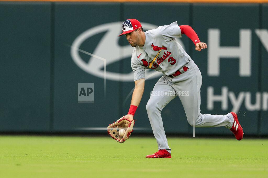 Butch Dill St. Louis Cardinals right fielder Dylan Carlson fields the ball on a hit by Atlanta Braves' Phil Gosselin during the third inning of a baseball game Monday, July 4, 2022, in Atlanta. (AP Photo/Butch Dill)