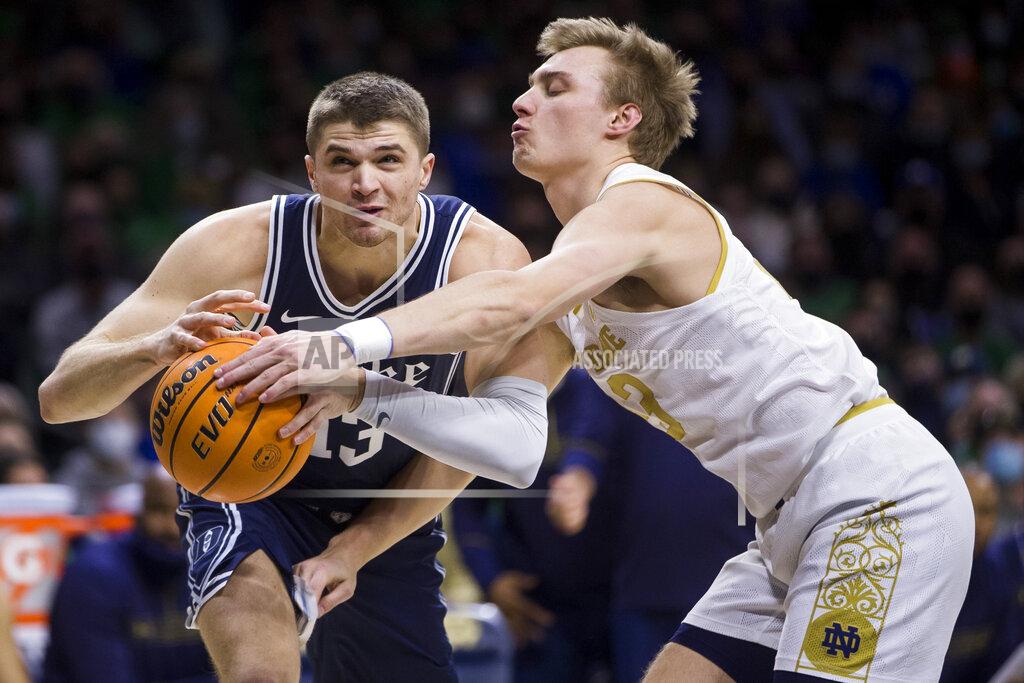 Robert Franklin Notre Dame's Dane Goodwin, right, knocks the ball away from Duke's Joey Baker (13) during the first half of an NCAA college basketball game Monday, Jan. 31, 2022, in South Bend, Ind. (AP Photo/Robert Franklin)
