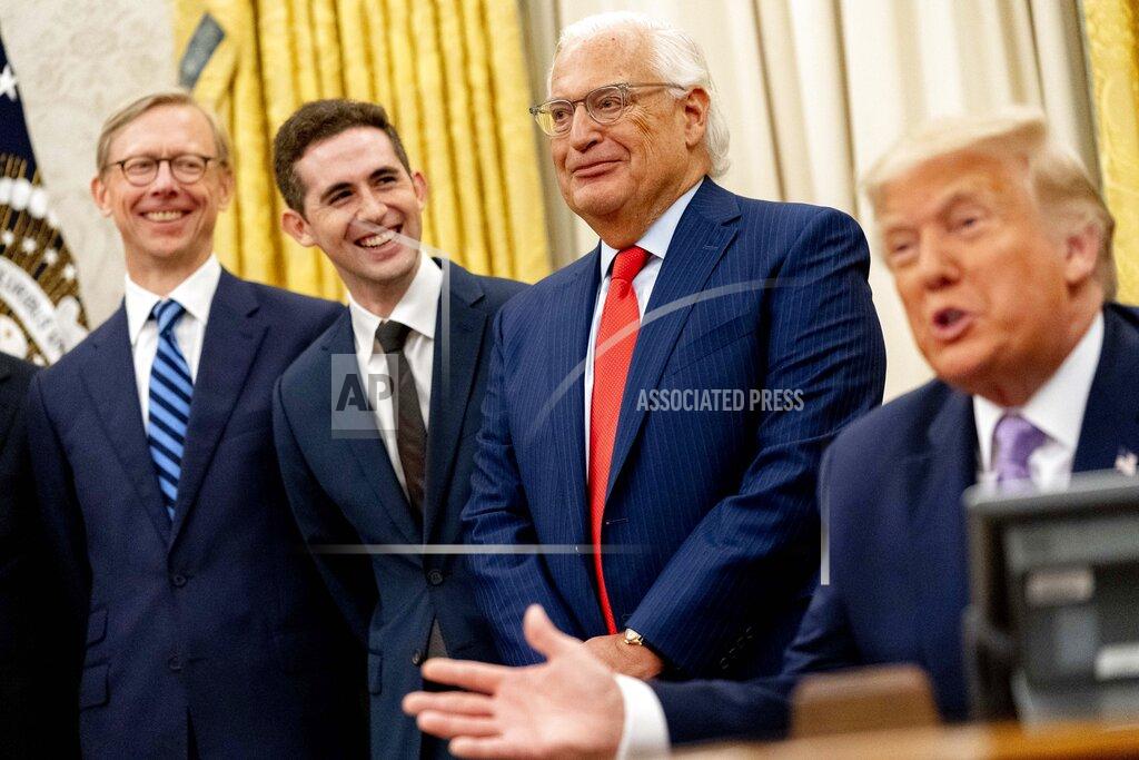Andrew Harnik President Donald Trump, accompanied by, from left, U.S. special envoy for Iran Brian Hook, Avraham Berkowitz, Assistant to the President and Special Representative for International Negotiations, and U.S. Ambassador to Israel David Friedman, speaks in the Oval Office at the White House, Wednesday, Aug. 12, 2020, in Washington. Trump said on Thursday that the United Arab Emirates and Israel have agreed to establish full diplomatic ties as part of a deal to halt the annexation of occupied land sought by the Palestinians for their future state. (AP Photo/Andrew Harnik)