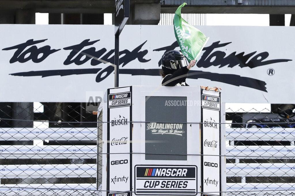 Brynn Anderson The green flag is waved to start the NASCAR Cup Series auto race Sunday, May 17, 2020, in Darlington, S.C. NASCAR, which has been idle for 10 weeks because of the coronavirus pandemic, returned to action with the Real Heroes 400 race at Darlington Raceway. (AP Photo/Brynn Anderson)