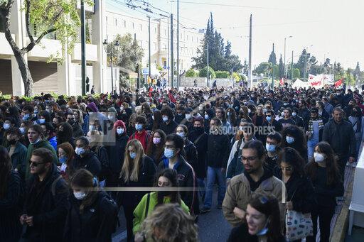Protesters march during a rally in Athens, Greece, on Monday Dec. 6, 2021. Hundreds of protesters marched the streets of the Greek capital, on the 13th anniversary of the 15-year old Alexis Grigoropoulos' fatal shooting by the police. (AP Photo/Michael Varaklas)