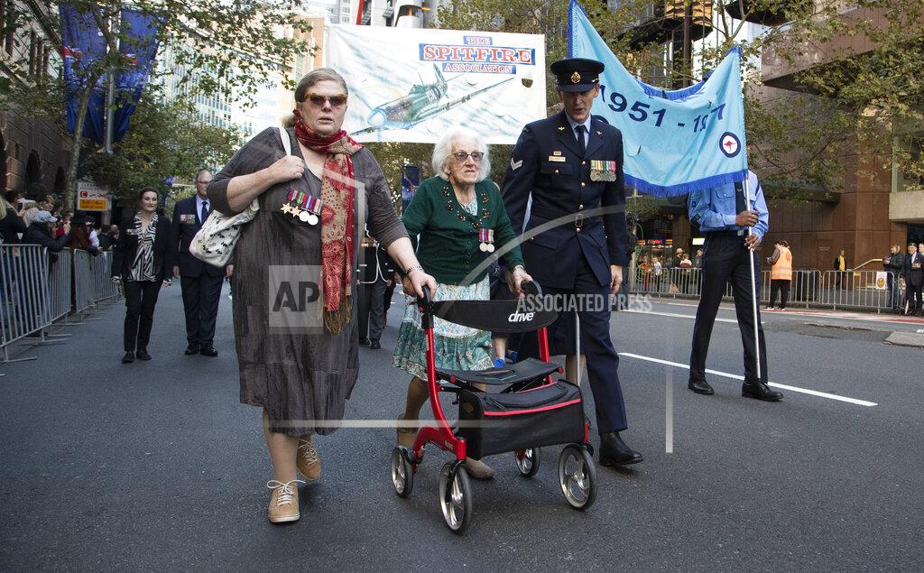 Mark Baker Veterans march during the Anzac Day parade in Sydney, Australia, Sunday, April 25, 2021. Australians and New Zealanders paid tribute to their war dead Sunday as both nations prepared to withdraw from their longest war in Afghanistan. (AP Photo/Mark Baker)