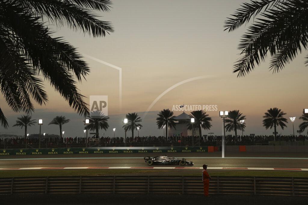 Hassan Ammar Mercedes driver Lewis Hamilton of Britain steers his car during the Emirates Formula One Grand Prix, at the Yas Marina racetrack in Abu Dhabi, United Arab Emirates, Sunday, Dec.1, 2019. (AP Photo/Hassan Ammar)