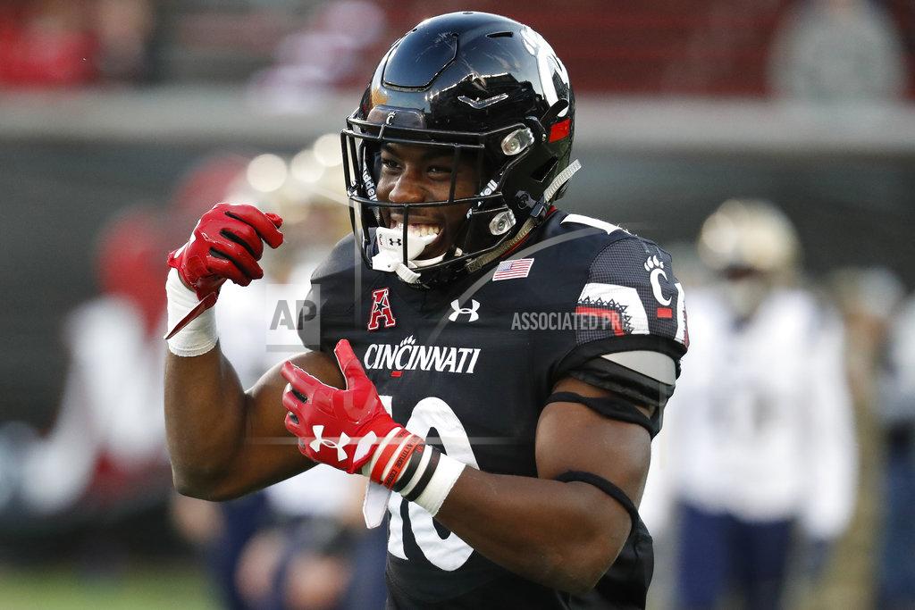 John Minchillo Cincinnati running back Charles McClelland celebrates after scoring a touchdown in the second half of an NCAA college football game against Navy, Saturday, Nov. 3, 2018, in Cincinnati. (AP Photo/John Minchillo)