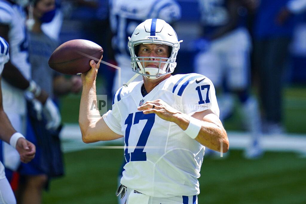 FILE - Indianapolis Colts quarterback Philip Rivers (17) throws during practice at the NFL team's football training camp at Lucas Oil Stadium in Indianapolis, Monday, Aug. 24, 2020. Rivers felt like a rookie when he drove to the Indianapolis Colts complex. New season, new facility, new teammates — and those familiar season-opening jitters. Yes, even for a 17-year veteran with eight Pro Bowl appearances, the adrenaline rush is reinvigorating. (AP Photo/Michael Conroy, File)