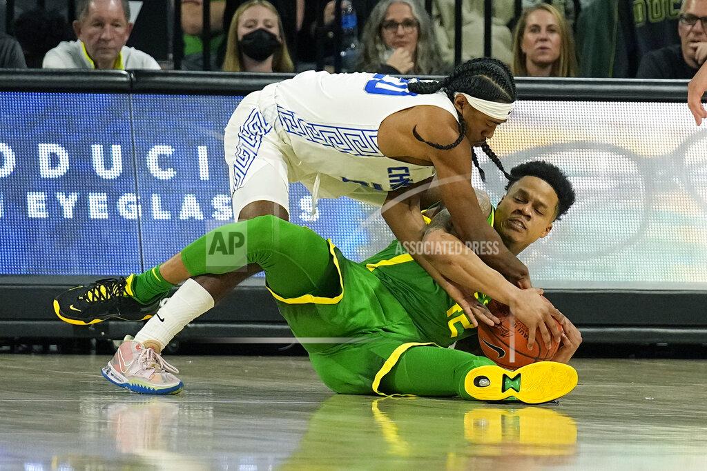 Rick Scuteri Chaminade guard Raazhel Watkins, top, and Oregon guard Jacob Young fight for the ball in the first half during an NCAA college basketball game at the Maui Invitational in Las Vegas, Monday, Nov. 22, 2021. (AP Photo/Rick Scuteri)