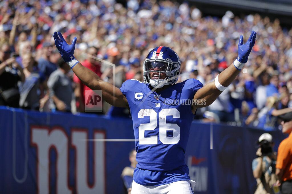 Adam Hunger New York Giants' Saquon Barkley celebrates his touchdown during the first half of an NFL football game against the Buffalo Bills, Sunday, Sept. 15, 2019, in East Rutherford, N.J. (AP Photo/Adam Hunger)