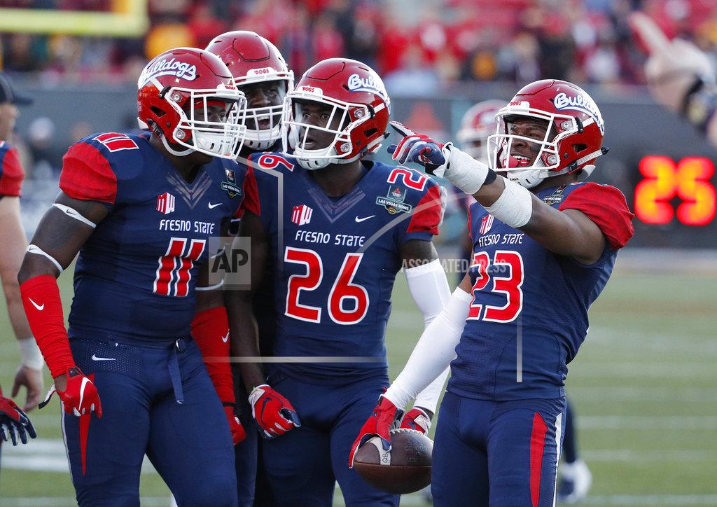 John Locher Fresno State defensive back Juju Hughes (23) celebrates after making an interception against Arizona State during the second half of the Las Vegas Bowl NCAA college football game, Saturday, Dec. 15, 2018, in Las Vegas. (AP Photo/John Locher)