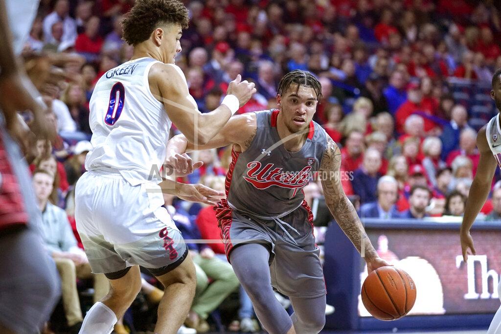 Rick Scuteri Utah forward Timmy Allen (1) drives on Arizona guard Josh Green during the first half of an NCAA college basketball game Thursday, Jan. 16, 2020, in Tucson, Ariz. (AP Photo/Rick Scuteri)