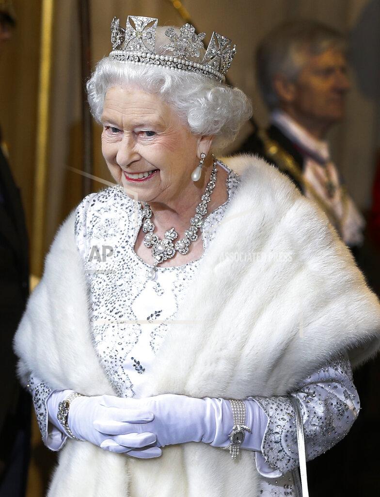 Kirsty Wigglesworth FILE - Britain's Queen Elizabeth II smiles as she leaves the State Opening of Parliament, at the Houses of Parliament in London on May 8, 2013. The State Opening of Parliament marks the formal start of the parliamentary year. (AP Photo/Kirsty Wigglesworth, Pool)