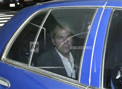 FILE - In this Nov. 18, 2003, file photo, John Hinckley Jr. arrives at U.S. District Court in Washington. Lawyers for Hinckley, the man who tried to assassinate President Ronald Reagan, are scheduled to argue in court Monday, Sept. 27, 2021, that the 66-year-old should be freed from restrictions placed on him after he moved out of a Washington hospital in 2016. (AP Photo/Evan Vucci, File)