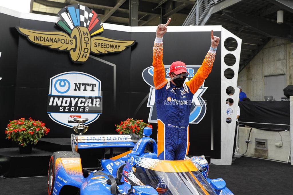 Darron Cummings Race driver Scott Dixon, of New Zealand, celebrates after winning the IndyCar auto race at Indianapolis Motor Speedway in Indianapolis, Saturday, July 4, 2020. (AP Photo/Darron Cummings)