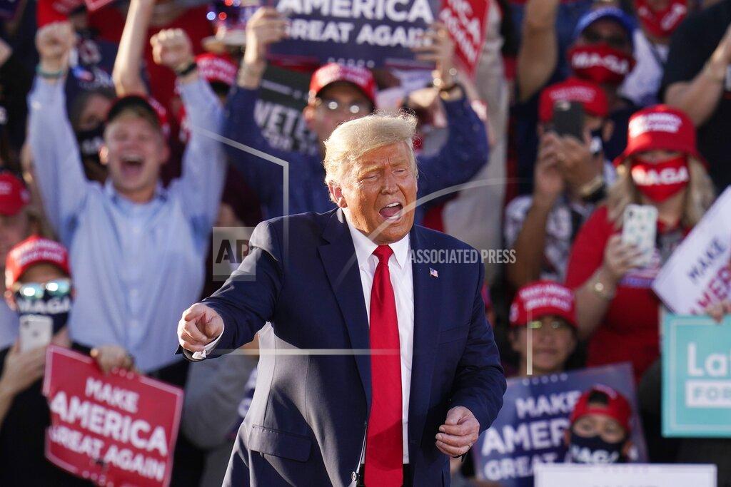 Ross D. Franklin President Donald Trump works the crowd after speaking at a campaign rally Monday, Oct. 19, 2020, in Tucson, Ariz. (AP Photo/Ross D. Franklin)