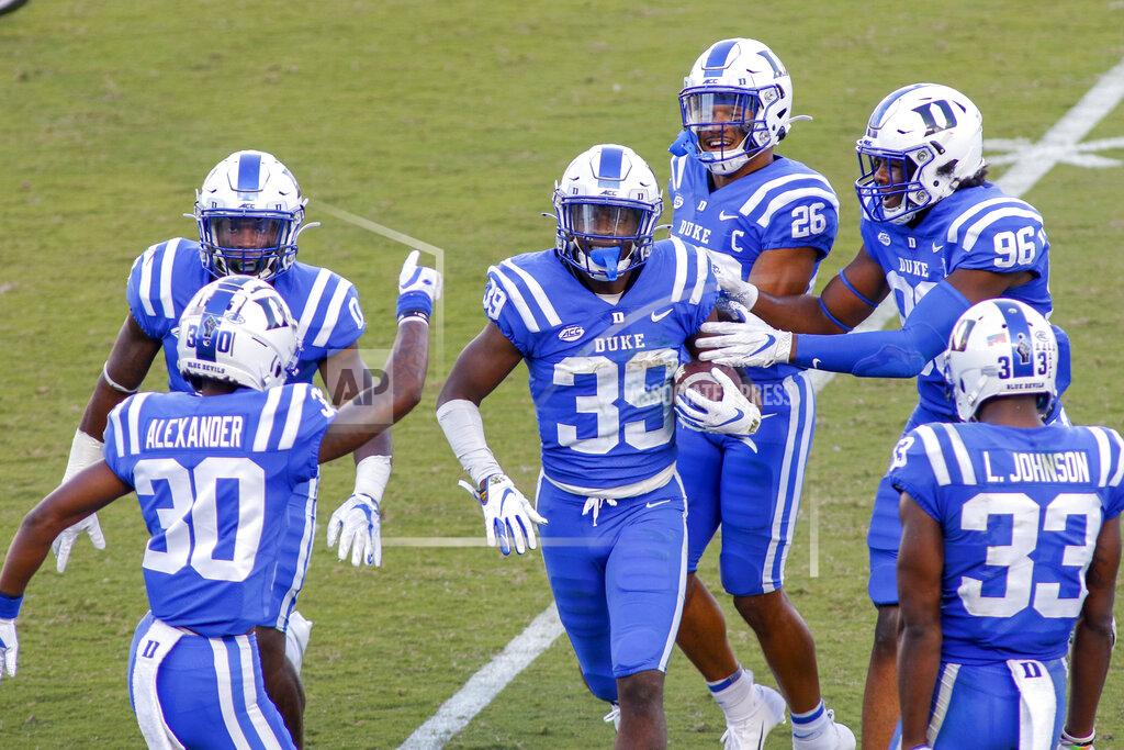 Nell Redmond Duke cornerback Jeremiah Lewis (39) celebrates with teammates after he intercepted a pass against the Virginia Tech during the first half of an NCAA college football game, Saturday, Oct. 3, 2020, in Durham, N.C. (Nell Redmond/Pool Photo via AP)