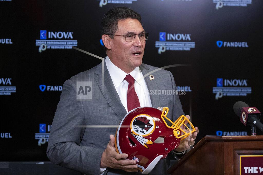 Alex Brandon FILE - In this Jan. 2, 2020, file photo, Washington Redskins new head coach Ron Rivera holds up a helmet during a news conference at the team's NFL football training facility in Ashburn, Va. The NFL Draft is April 23-25. (AP Photo/Alex Brandon, File)
