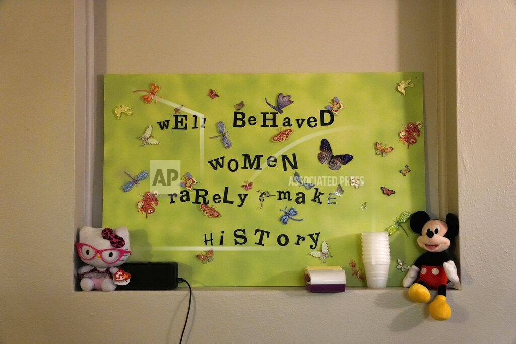 Rebecca Blackwell A sign adorns the wall inside a procedure room where doctors perform abortions, ahead of the arrival of patients at the start of the workday, Saturday, Oct. 9, 2021, at Hope Medical Group for Women in Shreveport, La. The nation's most restrictive abortion law is driving many women from Texas to seek services in neighboring states. The abortion clinic in Shreveport is among the clinics being inundated. (AP Photo/Rebecca Blackwell)