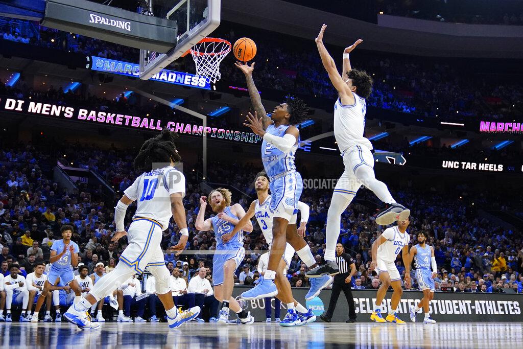 Matt Rourke North Carolina's Caleb Love (2) goes up for a shot past UCLA's Jules Bernard (1) during the second half of a college basketball game in the Sweet 16 round of the NCAA tournament, Friday, March 25, 2022, in Philadelphia. (AP Photo/Matt Rourke)