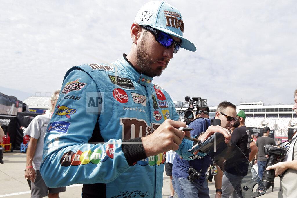 Gerry Broome Kyle Busch signs autographs during practice for Sunday's NASCAR Cup Series auto race at Charlotte Motor Speedway in Concord, N.C., Saturday, Sept. 28, 2019. (AP Photo/Gerry Broome)