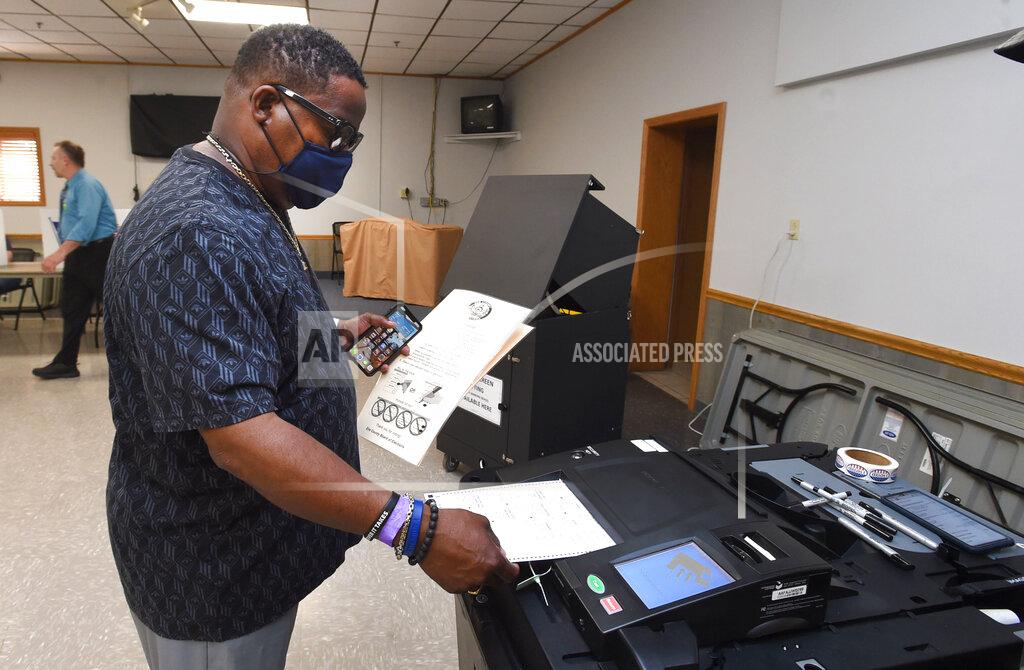 Jack Hanrahan Sonny Concepcion of Millcreek Township casts his vote in the municipal primary, Tuesday, May 18, 2021, at the Belle Valley Social Hall, in Millcreek Township, near Erie, Pa. (Jack Hanrahan/Erie Times-News via AP)