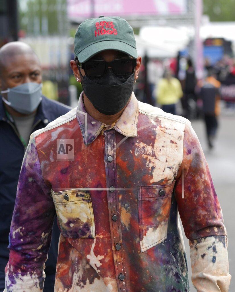 Luca Bruno Mercedes driver Lewis Hamilton of Britain arrives in the paddock ahead the Emilia Romagna Formula One Grand Prix, at the Enzo and Dino Ferrari racetrack, in Imola, Italy, Sunday, April 24, 2022. (AP Photo/Luca Bruno)
