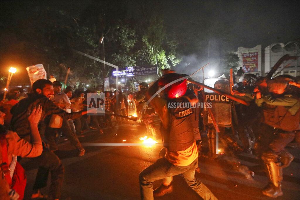 Mahmud Hossain Opu Demonstrators clash with police as they protest the death in prison of a writer who was arrested on charges of violating the sweeping digital security, in Dhaka, Bangladesh, Friday, Feb. 26, 2021. Mushtaq Ahmed, 53, was arrested in Dhaka in May last year for making comments on social media that criticized the Prime Minister Sheikh Hasina government's handling of the coronavirus pandemic. He had been denied bail at least six times. (AP Photo/Mahmud Hossain Opu)
