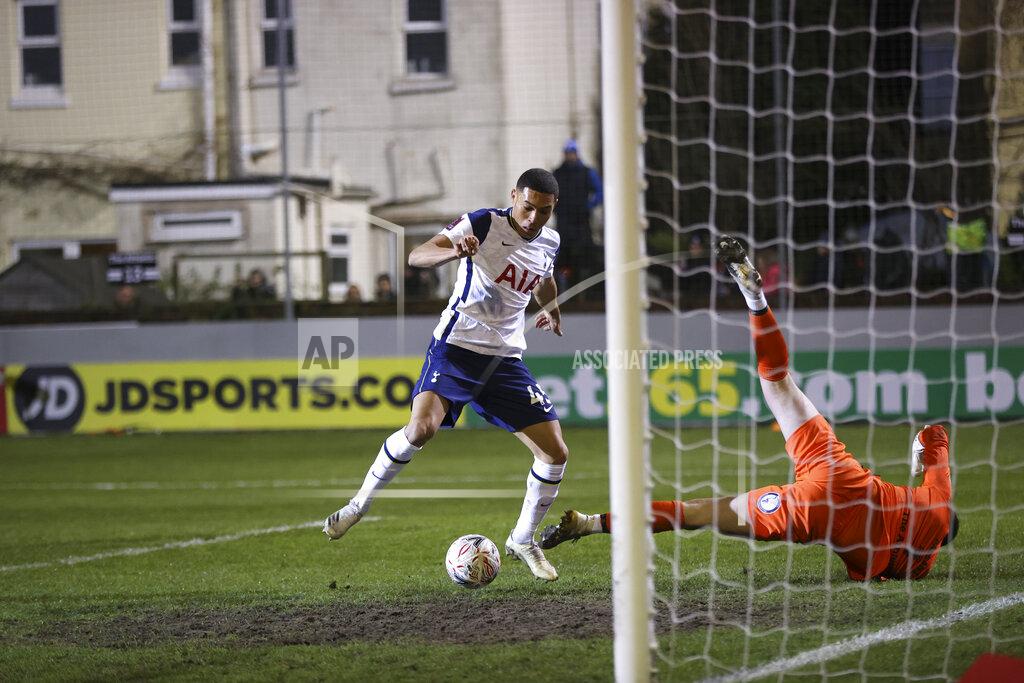 Clive Brunskill Tottenham's Carlos Vinicius scores his side's first goal passing Marine's goalkeeper Bayleigh Passant, right, during the English FA Cup third round soccer match between Marine and Tottenham Hotspur at Rossett Park stadium in Crosby, Liverpool, Sunday, Jan. 10, 2021. (Clive Brunskill/Pool via AP)