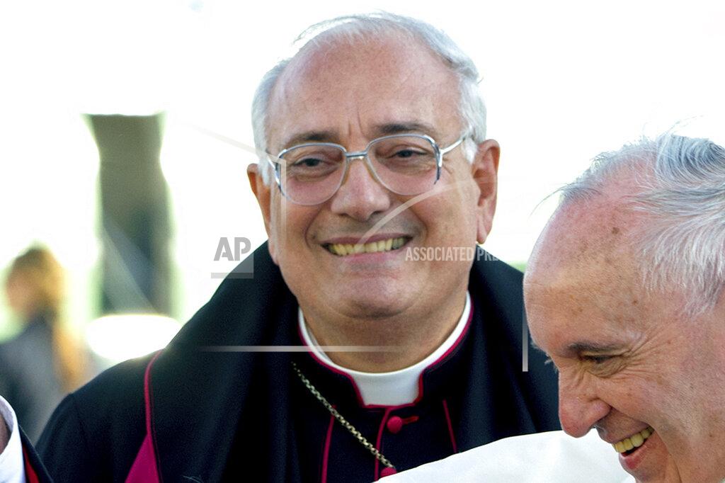 FILE - This Thursday, Sept. 24, 2015 file photo shows Brooklyn Bishop Nicholas DiMarzio as Pope Francis, right, arrives at John F. Kennedy International Airport in New York. The longtime head of the Roman Catholic Church in Brooklyn said Friday, Nov. 27, 2020, that a ruling by the Supreme Court that barred New York from enforcing certain restrictions on religious services in areas hit hard by the coronavirus is a “good decision” that guarantees constitutional protections for the free exercise of religion. (AP Photo/Craig Ruttle, Pool, File)