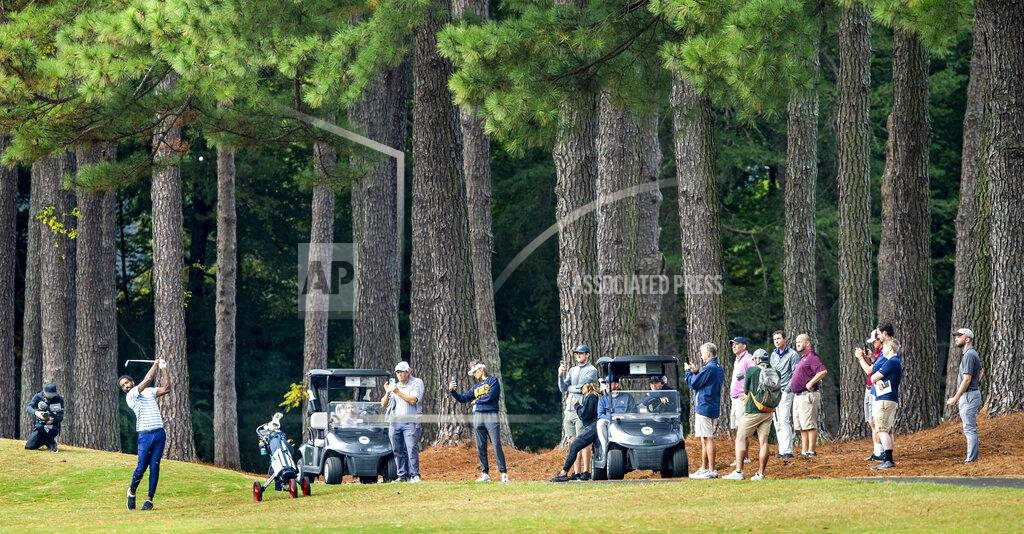 Woody Marshall The gallery watches as North Carolina A&T's J.R. Smith hits toward the fifth green during the second round of the Phoenix Invitational golf tournament in Burlington, N.C., Tuesday, Oct. 12, 2021. Smith spent 16 years playing in the NBA, winning two world championships. (Woody Marshall/News & Record via AP)
